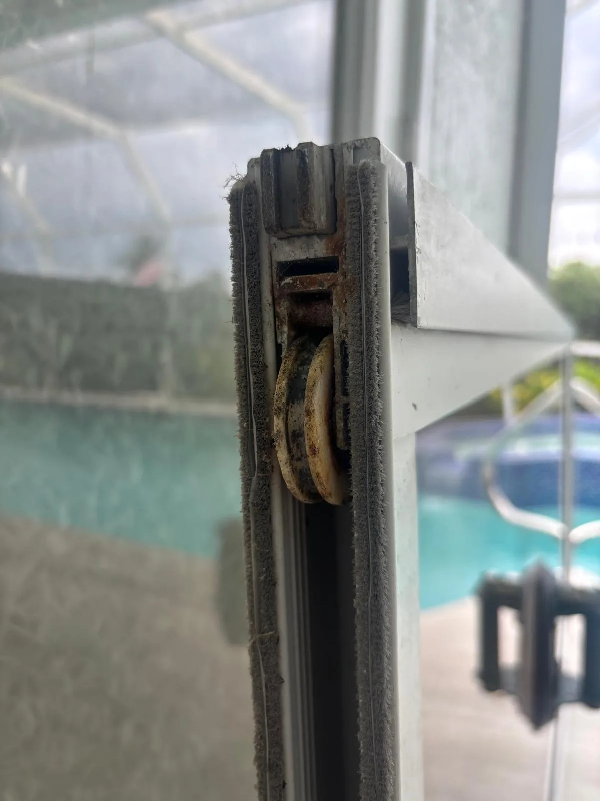 Worn sliding door roller that needs replacement
